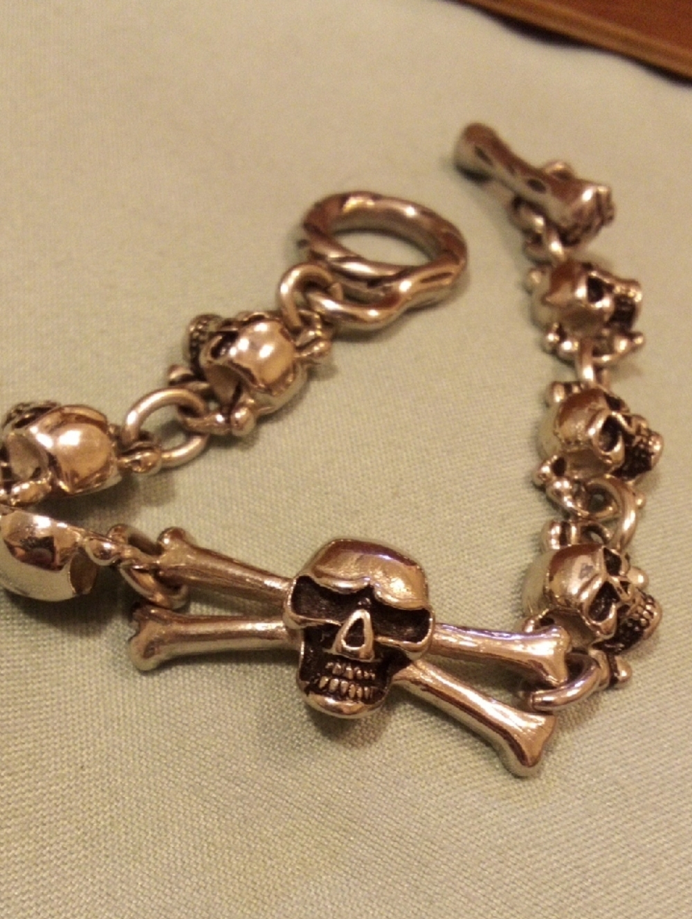 Skull & Crossbones Chunky Bracelet in Metallic Gold Tone